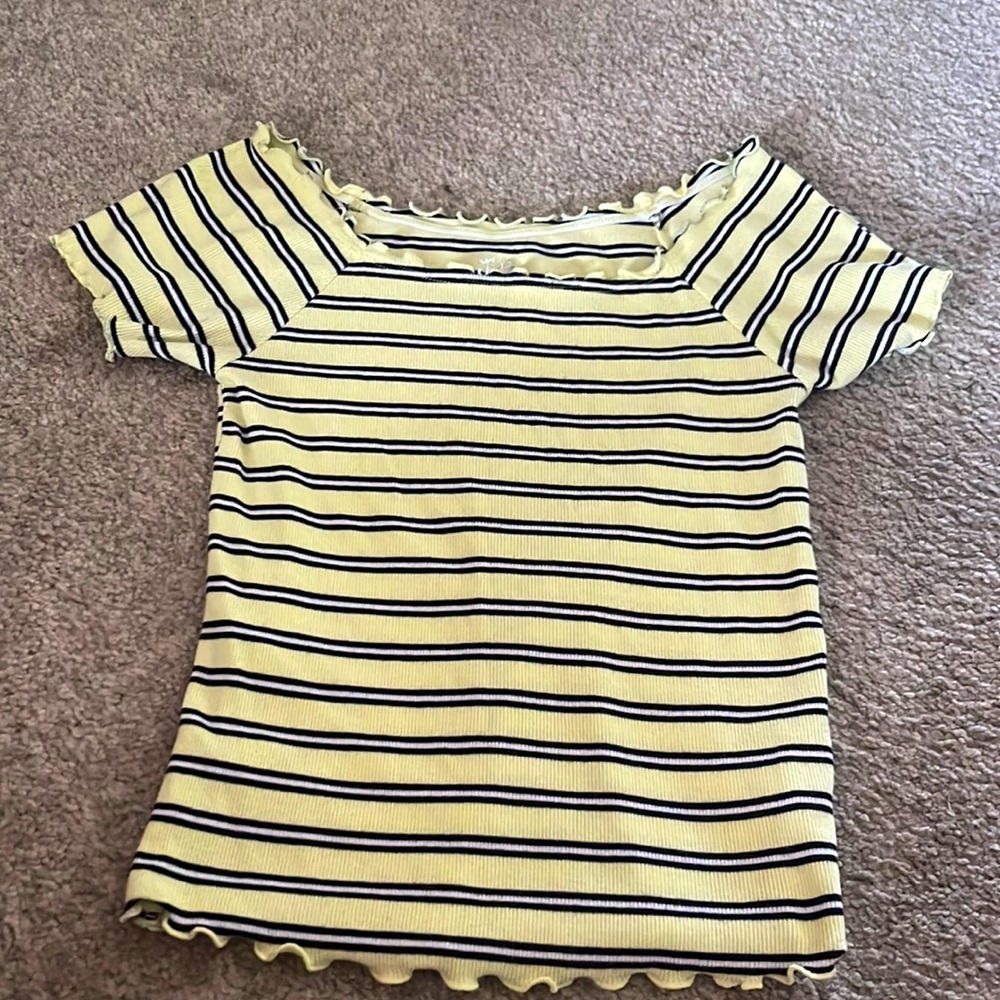 It is a little crop top and have ruffles on the ends
